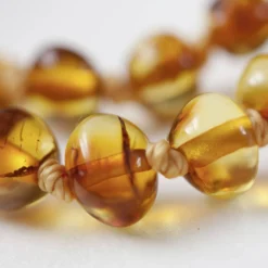 Baby Bernsteinkette rund cognac